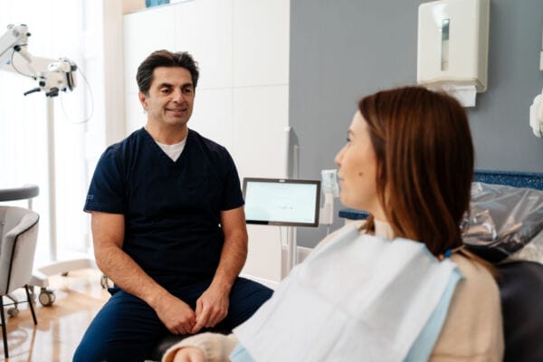 dentist talking to patient